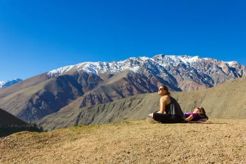 two girls in nature looking at sky
